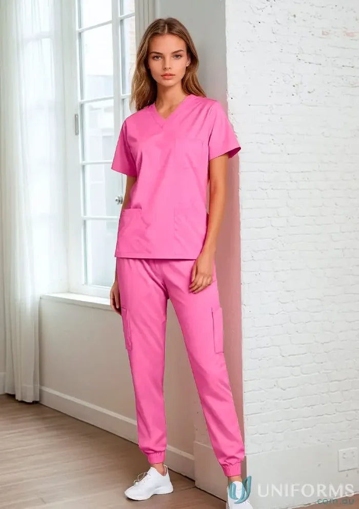 Pink women’s stretch jumper scrub set with 9-pocket jogger design for women