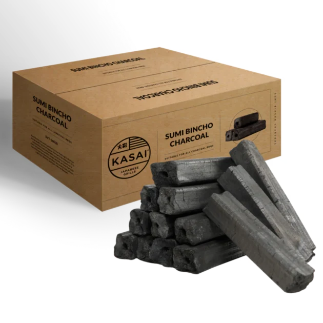 A box of Kasai Sumi Bincho charcoal with several charcoal briquettes displayed in front of it on white background.