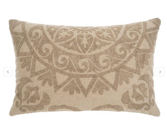 A rectangular Suzani boucle pillow in beige color with a geometric pattern.