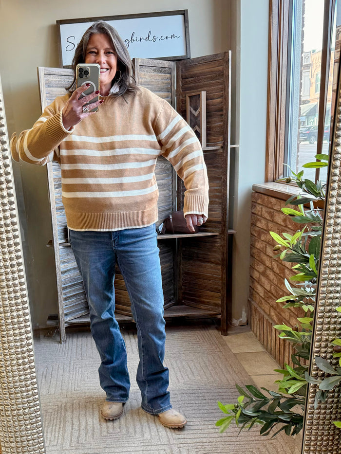 Striped crew neck sweater with tan and cream horizontal bands, long sleeves, ribbed cuffs