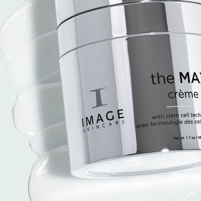 Close-up of the MAX™ crème | IMAGE Skincare jar with a smooth white cream texture in the background, highlighting a premium skincare product.