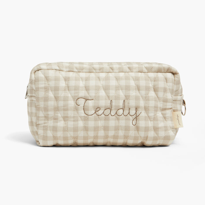 Quilted pouch with 'Teddy' embroidery on a white background