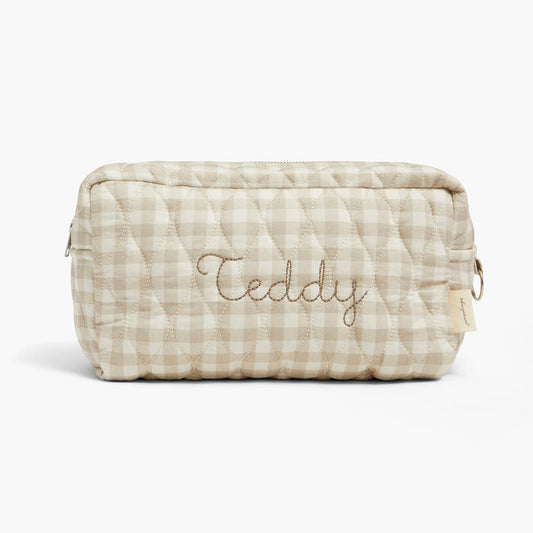 Quilted pouch with 'Teddy' embroidery on a white background