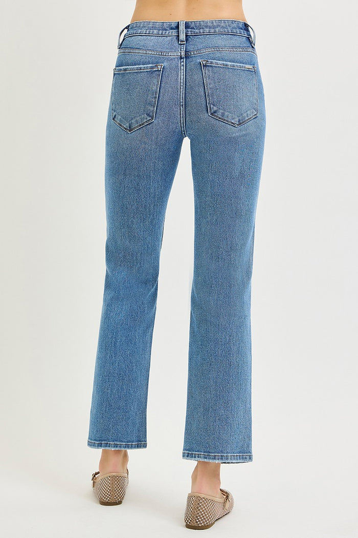 Women’s mid-rise ankle jeans in medium blue, back view with two patch pockets