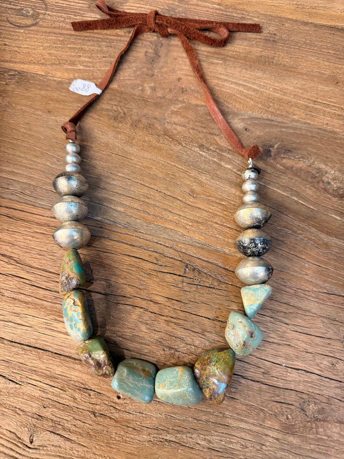 Turquoise irregular beads and brown leather strand necklace with silver-tone beads
