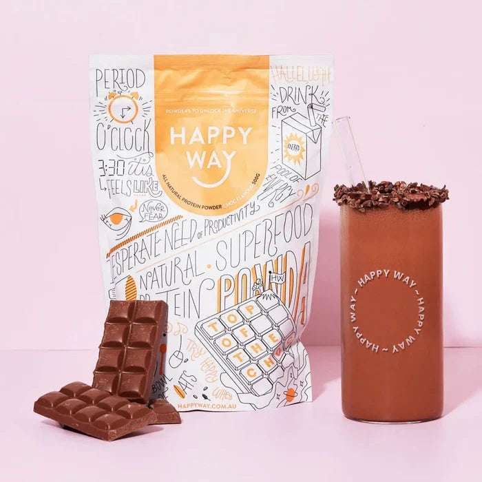 Happy Way protein powder package, chocolate bar, and cup with chocolate topping on a pink background
